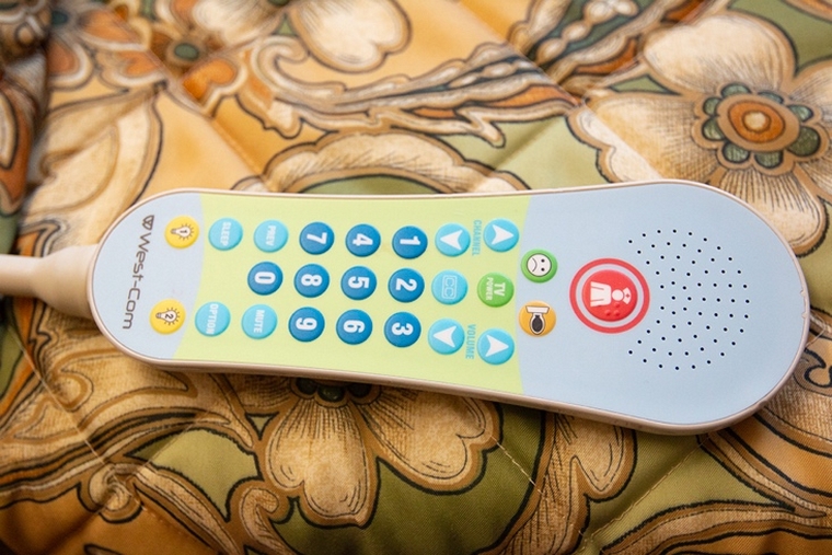 High-tech resident remote (e.g., nurse call button, television & overhead light control...).